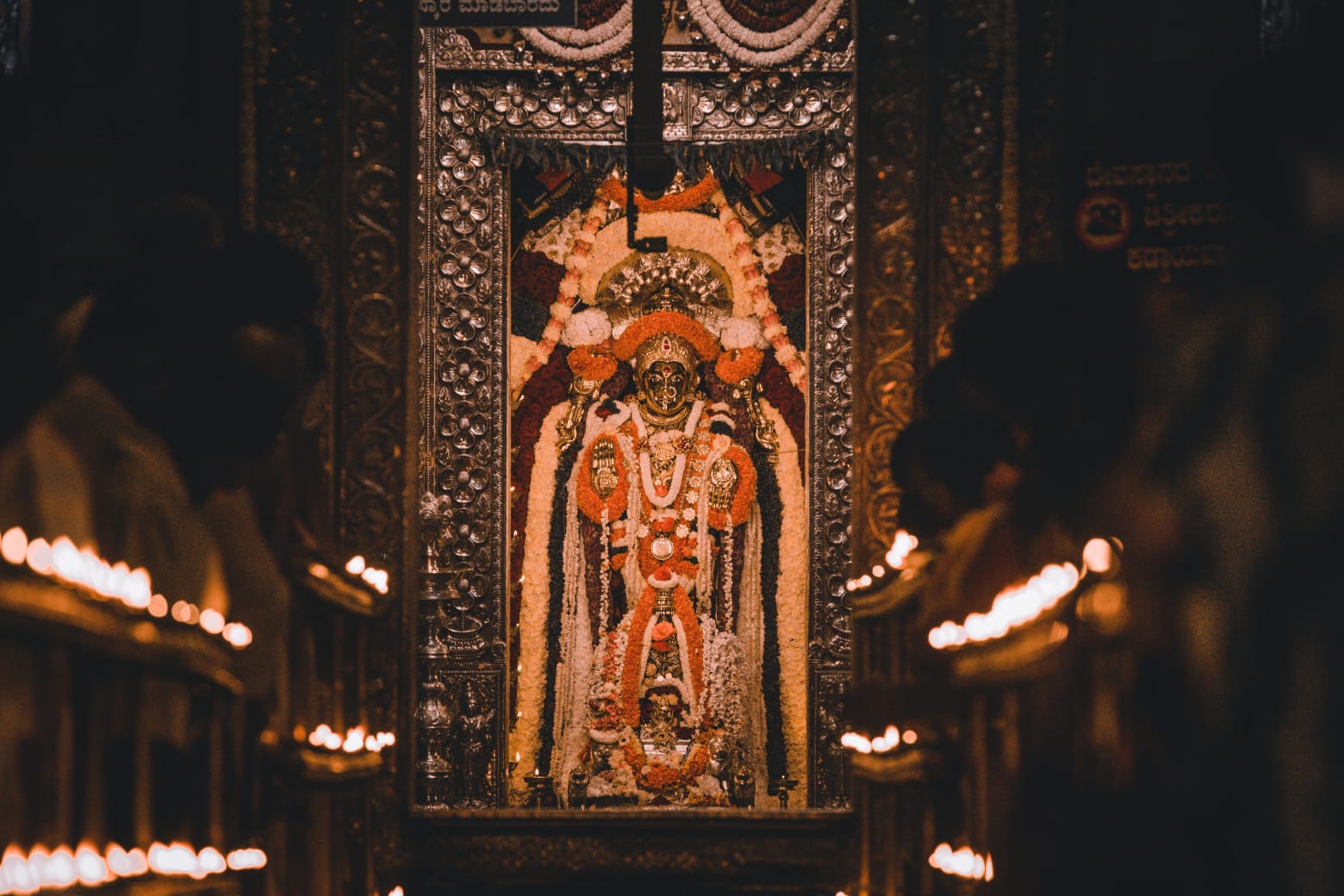 Sri Annapoorneshwari deity decorated with garlands at Horanadu temple